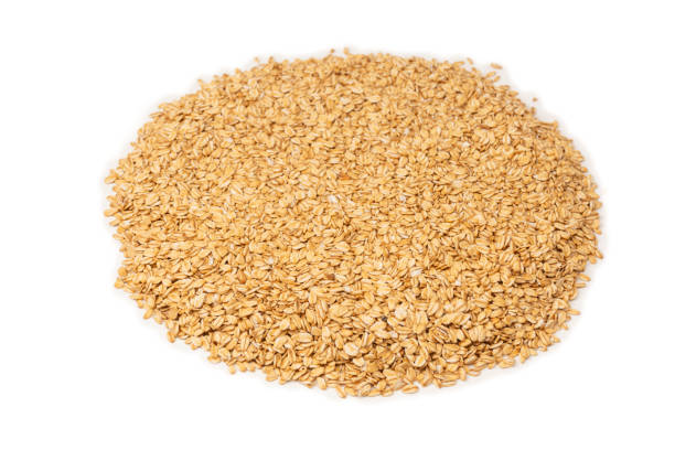 istock Oat-flakes isolated on a white background. 2155515900