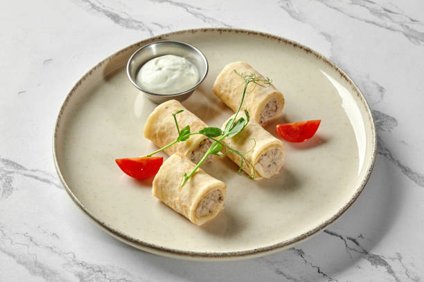 istock Thin crepes with ground chicken meat and sour cream 2155516208