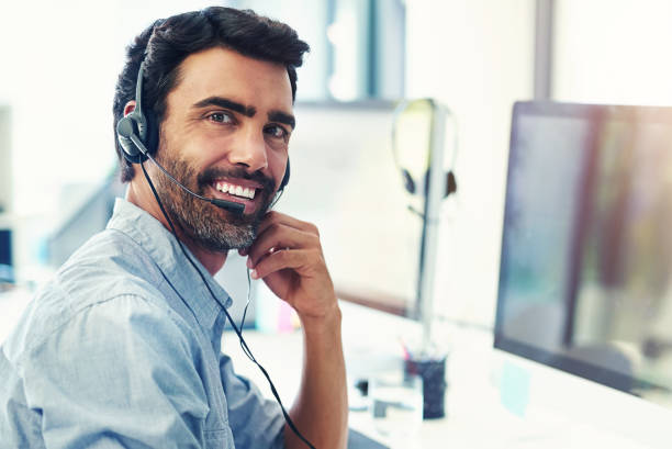 istock Portrait, smile and man with customer service, telemarketing and computer with tech support, crm or help desk. Person, consultant or employee with a pc, happy or call center with business or internet 2155518299