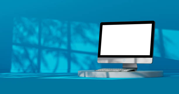 istock Modern Desktop Computer with Blank Screen for Your Design on a Stage in Blue Room with Sun Shadows. 3d Rendering 2155518390