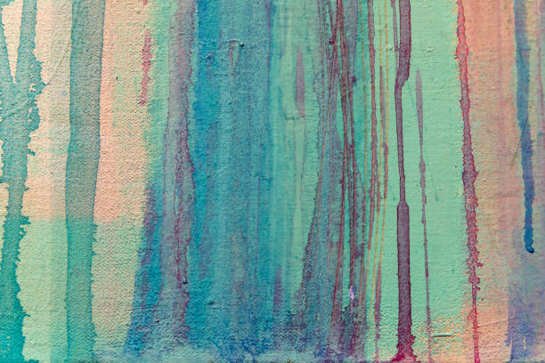 Colorful watercolor paint splashes over paper background