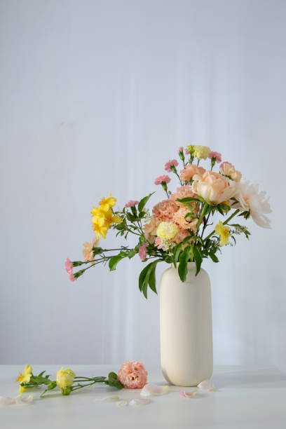 istock beautiful bouquet in white vase in sunlight 2155519618