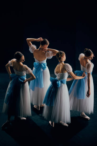 istock Swift, elegant movements of ballerinas captured in ghostly blur, creating ethereal and hauntingly beautiful scene. 2155520004