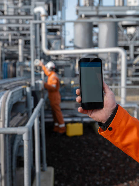 istock Industrial Worker with Smartphone at Electrical Installation Site 2 2155520974