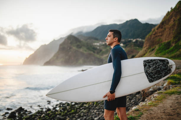 istock Surfer on the beach is looking for the best wave. 2155521739