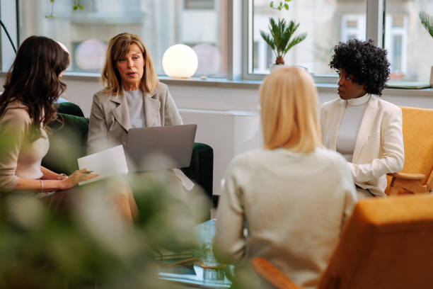 istock Coworkers working in a company lounge 2155523055