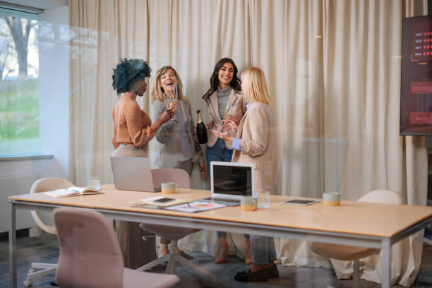 istock Businesswomen party in an office 2155523084