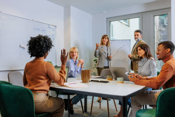 istock Stylish businesspeople in a meeting 2155523186