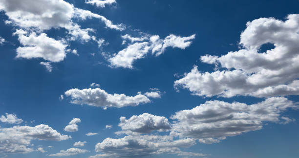 istock Fluffy cumulus clouds on blue sky background. Cloudscape 2155526750