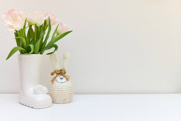 Bouquet of fresh white tulips in vase. Greeting card for mother's day or happy birthday. Space for text. Easter, Spring or summer greeting card template. Congratulations on Women's Day on March 8.