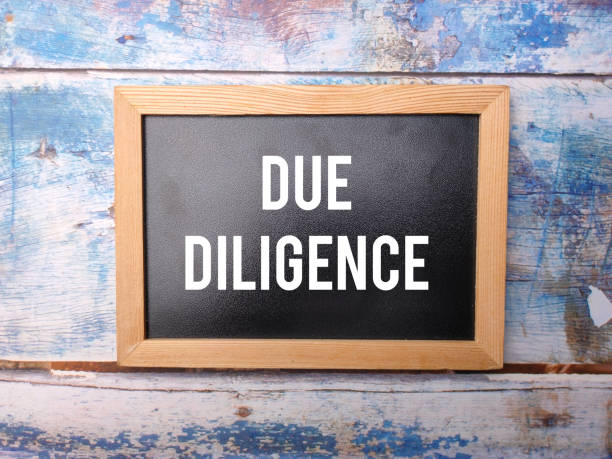 istock Black wooden board with the word DUE DILIGENCE 2155528691