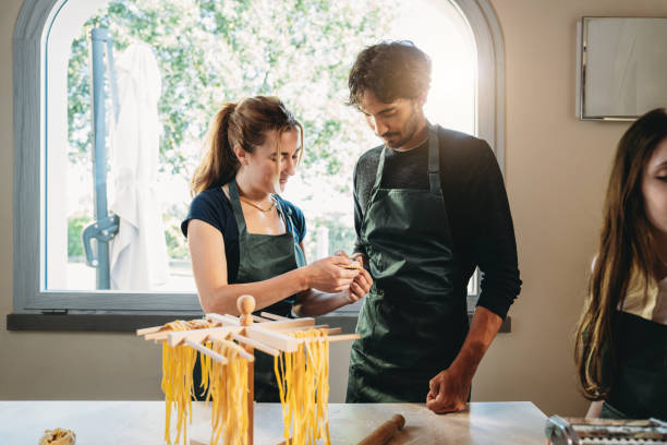 People are making homemade ravioli during a cooking class
