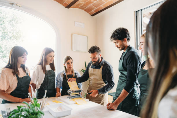 istock Participants of a cooking class are learning how to make homemade pasta 2155528951