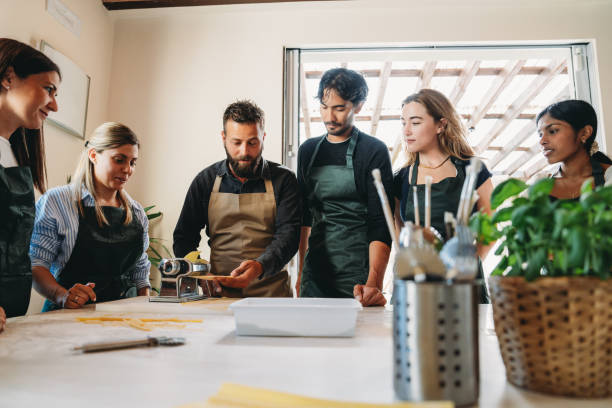 istock Participants of a cooking class are learning how to make homemade pasta 2155528963