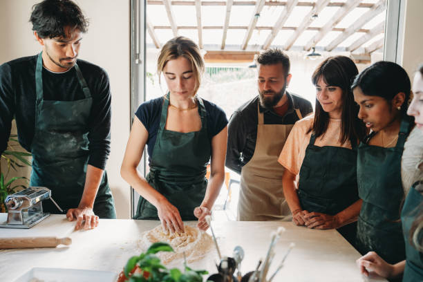 istock People are enjoying a cooking class to learn how to make homemade pasta 2155528989