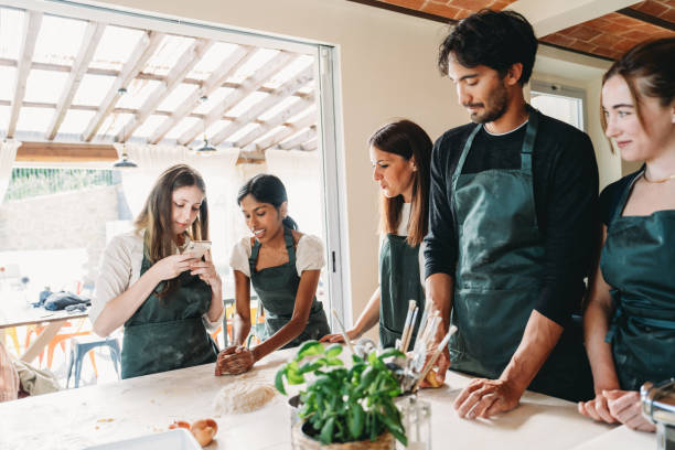 istock Friends are enjoying a cooking class together 2155529011