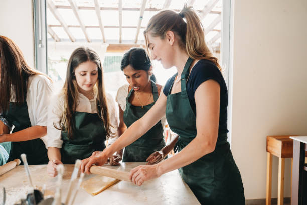 istock People are enjoying a cooking class together 2155529036