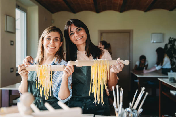 istock Portrait of two friends after a cooking class 2155529074