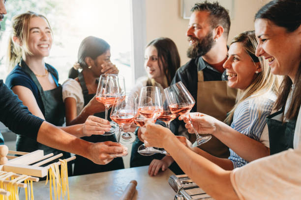 istock People are toasting together during a cooking class 2155529085