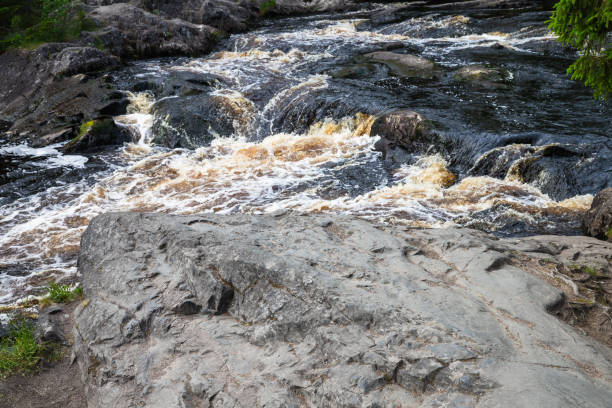 istock Fast stream water going over rocks. Waterfalls of Ruskeala 2155529402