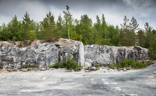 istock Karelian landscape with former marble quarry on a cloudy day 2155529406