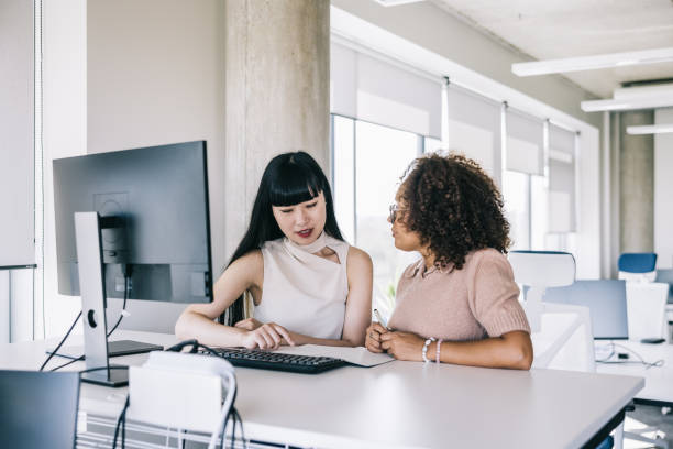 istock Two female colleagues working together at the office 2155530129