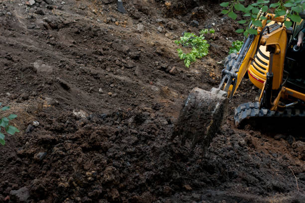 istock Excavator digs ground with bucket 2155530341