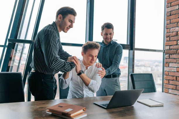 istock Successful teamwork of three colleagues with laptops in the office 2155530581