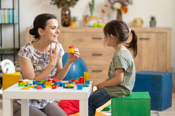 istock Therapist and child engaging with blocks 2155530633