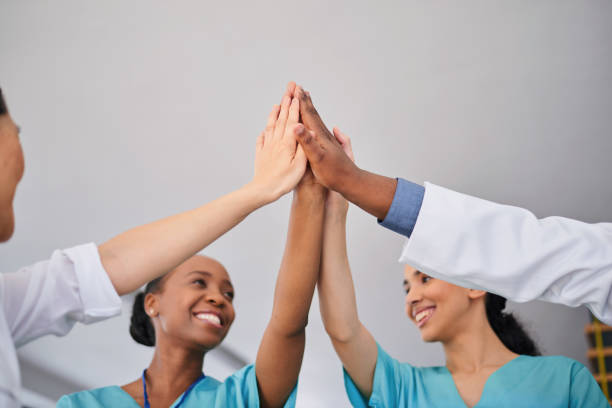 istock Diverse Medical Team Doing High-Five in Hospital Setting 2155531209