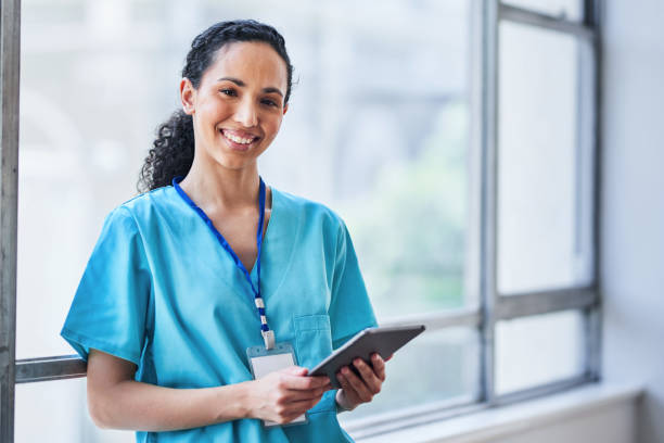 istock Friendly Female Doctor Smiling and Using Tablet in Modern Hospital Setting 2155531227