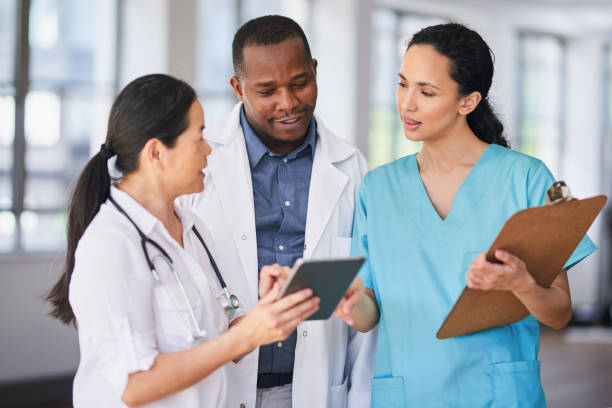 istock Diverse Medical Team Collaborating in Hospital Setting 2155531236