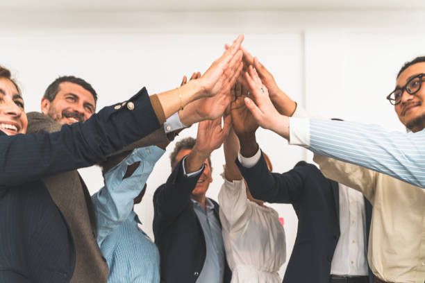 istock Team High Five Celebrating Success in Office 2155532359