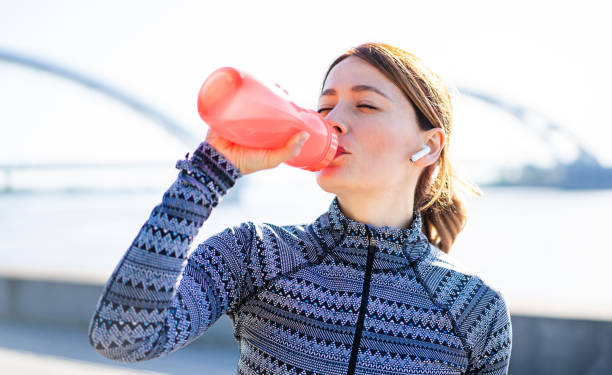 istock Sporty woman taking a break after running workout. 2155533271