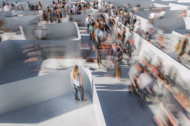 Woman watching people running in a maze