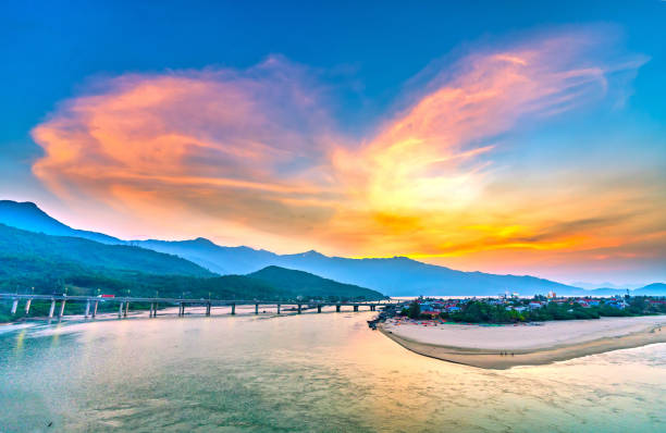 Lang Co bay in the sunset with a small fishing village completely below. This place was voted the most beautiful bay in the world in Hue, Vietnam