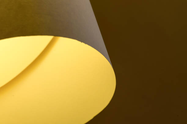 istock Abstract background with lights and shadows in yellow and orange tones. 2155534283
