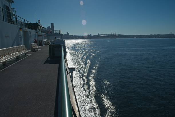 istock Ferry Boat Deck with City Skyline and Shimmering Water 2155534920