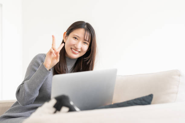 istock young asian woman using laptop 2155537867