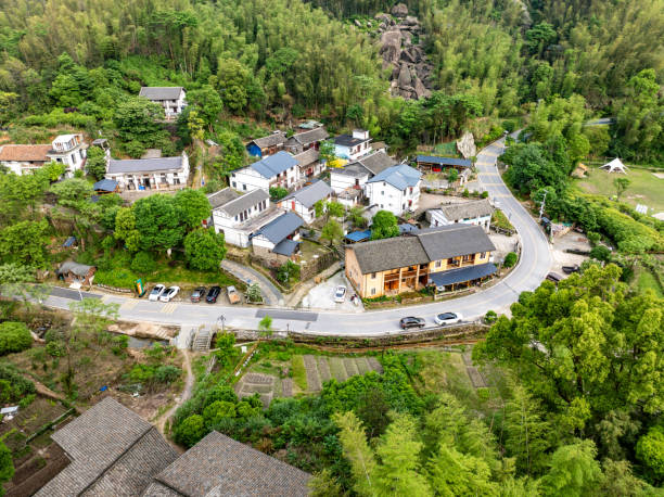 istock Winding mountain road with green forest overlooking 2155540412