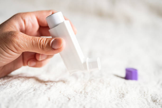 istock Females hand holding inhaler for asthmatics. 2155541388