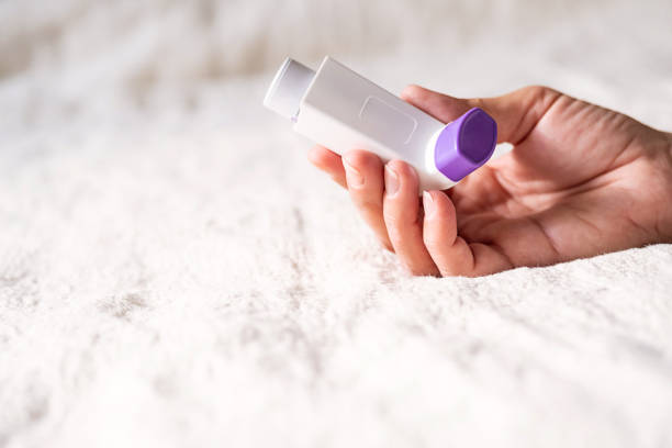 istock Females hand holding inhaler for asthmatics. 2155541392