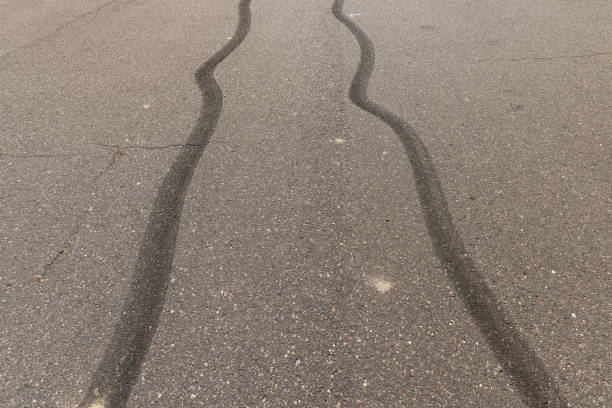istock tire tracks during dangerous driving on the road 2155541951