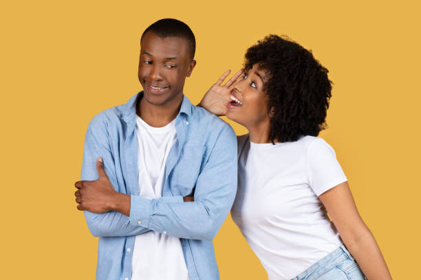 istock Two people in a secret sharing moment 2155546804