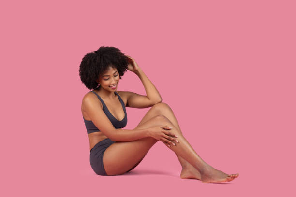 istock Young woman sitting and smiling gently 2155547309