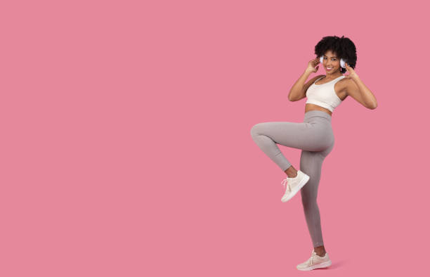 istock Energetic lady in a playful sporty stance 2155547320