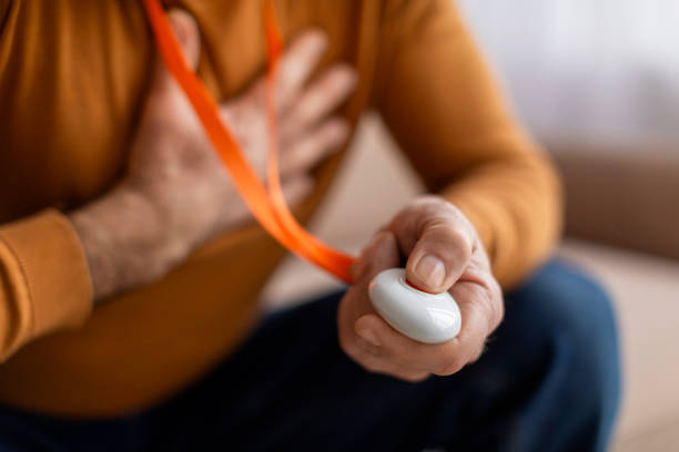 istock Closeup of man hand pressing alarm button for emergency 2155547589
