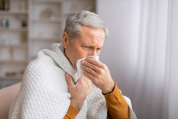 istock Elderly person reading with a square in front 2155547616