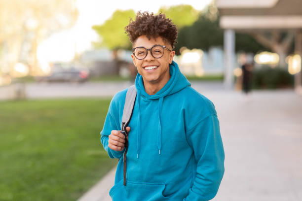 istock Cheerful brazilian student guy standing with his backpack outside 2155547836