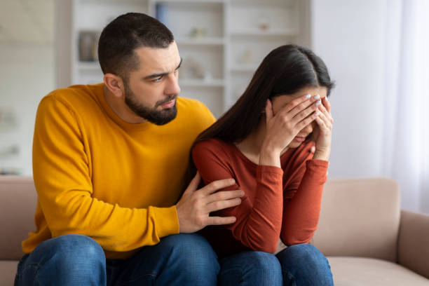 istock Loving Young Man Comforting His Upset Girlfriend At Home 2155547954
